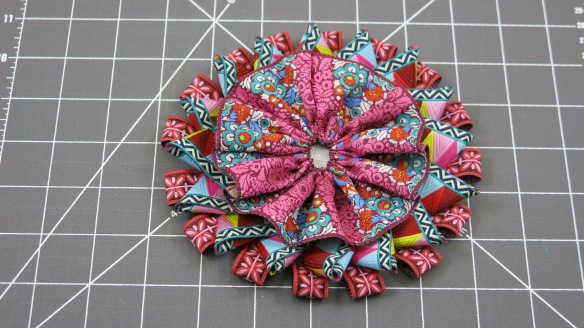 The Third Layer is a Gathered Ribbon Rosette Stitched to the Center to Cover all the Ends of the Ribbon Loops