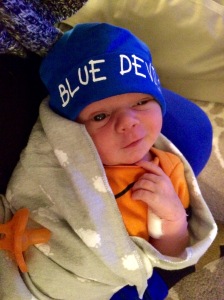 Here's Ollie, born 2/28/15, just in time for March Madness! One week old and sporting his Duke Blue Devils hat.